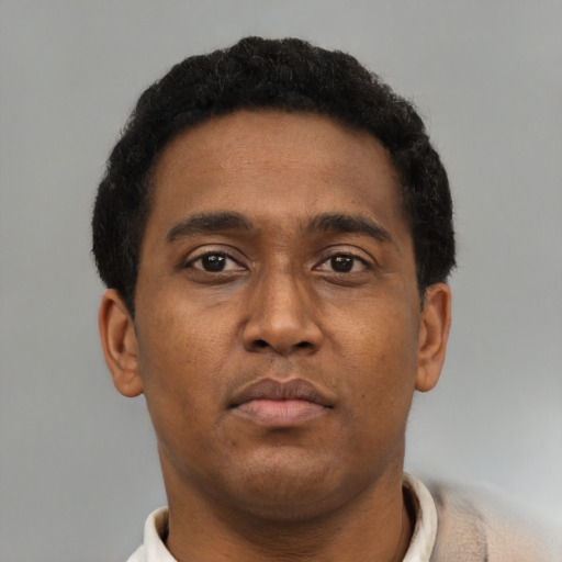 Neutral black young-adult male with short  brown hair and brown eyes