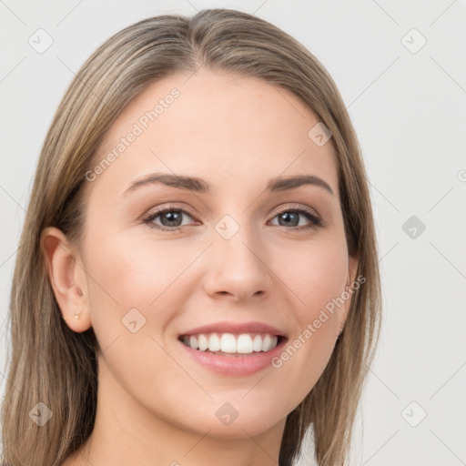 Joyful white young-adult female with long  brown hair and grey eyes