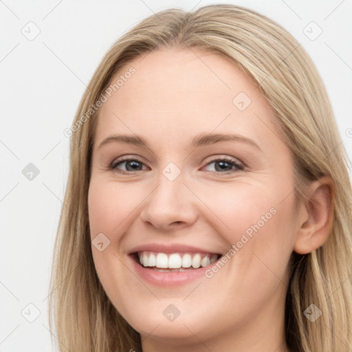 Joyful white young-adult female with long  brown hair and blue eyes