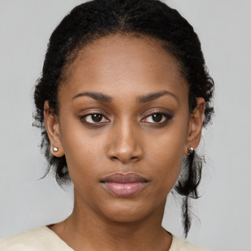 Neutral black young-adult female with medium  black hair and brown eyes