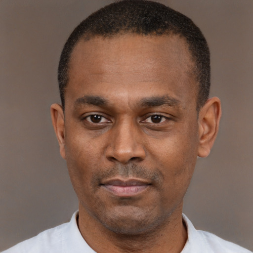 Neutral black adult male with short  black hair and brown eyes