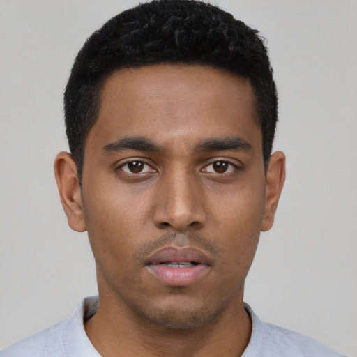 Neutral black young-adult male with short  black hair and brown eyes