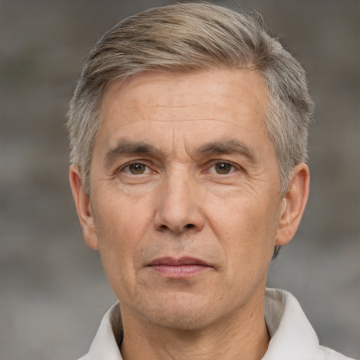 Neutral white middle-aged male with short  gray hair and brown eyes