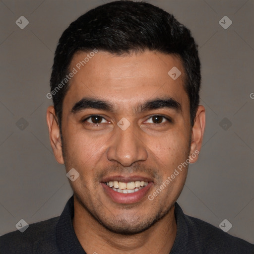 Joyful white young-adult male with short  black hair and brown eyes