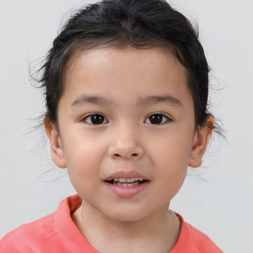 Joyful white child female with short  brown hair and brown eyes