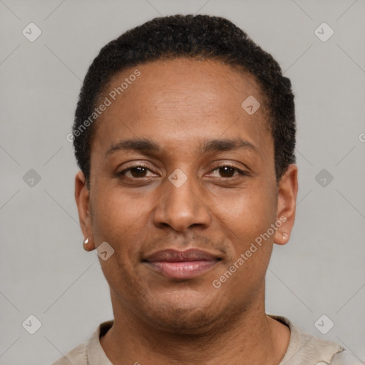 Joyful latino young-adult male with short  brown hair and brown eyes