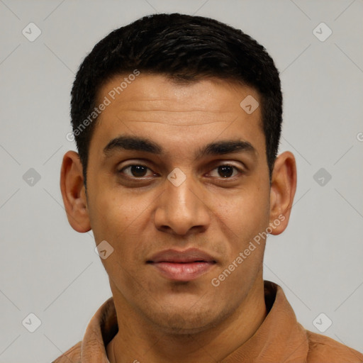 Joyful latino young-adult male with short  black hair and brown eyes