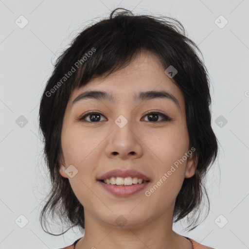 Joyful asian young-adult female with medium  black hair and brown eyes