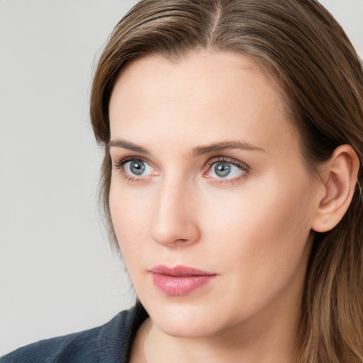 Neutral white young-adult female with long  brown hair and grey eyes