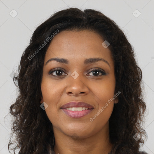Joyful black young-adult female with long  brown hair and brown eyes