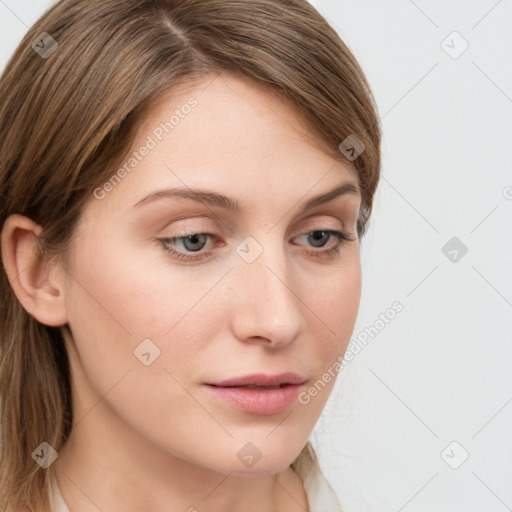 Joyful white young-adult female with long  brown hair and blue eyes