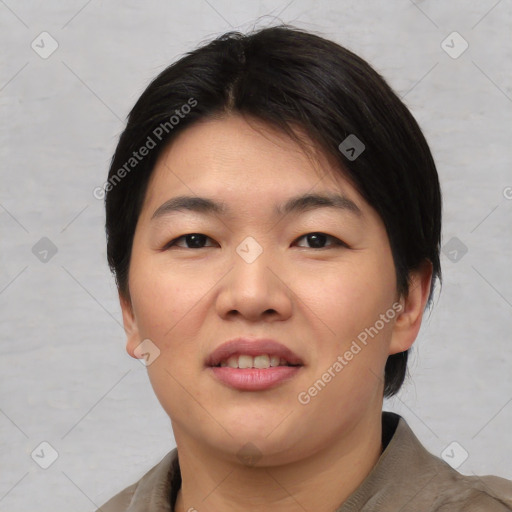 Joyful asian young-adult female with short  black hair and brown eyes