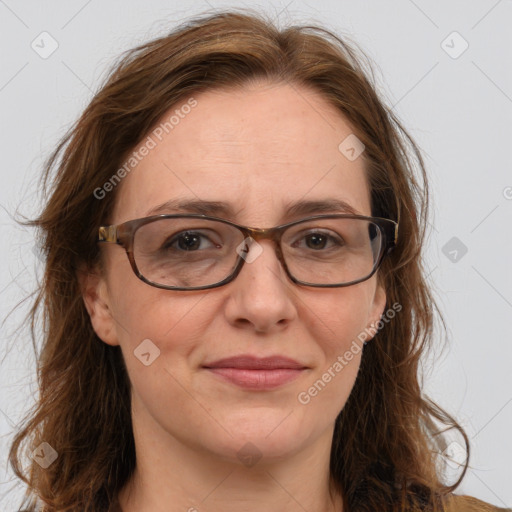 Joyful white adult female with long  brown hair and brown eyes