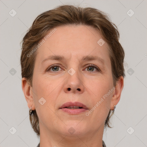 Joyful white adult female with medium  brown hair and grey eyes