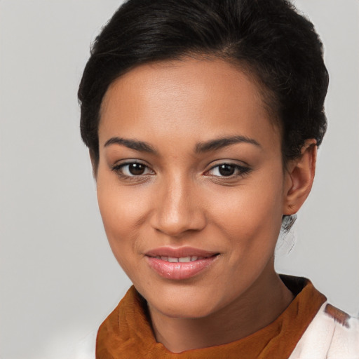 Joyful latino young-adult female with short  brown hair and brown eyes