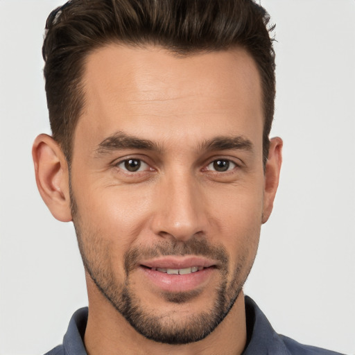 Joyful white young-adult male with short  brown hair and brown eyes