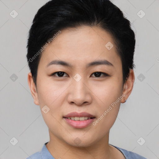 Joyful asian young-adult female with short  black hair and brown eyes