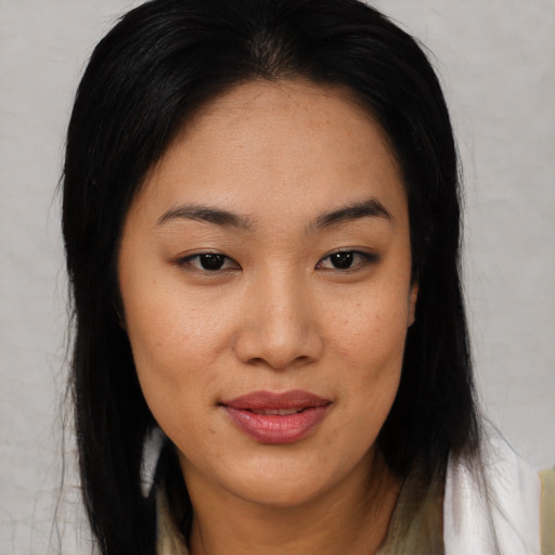 Joyful asian young-adult female with medium  brown hair and brown eyes