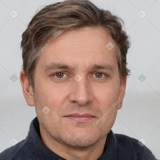 Joyful white adult male with short  brown hair and grey eyes