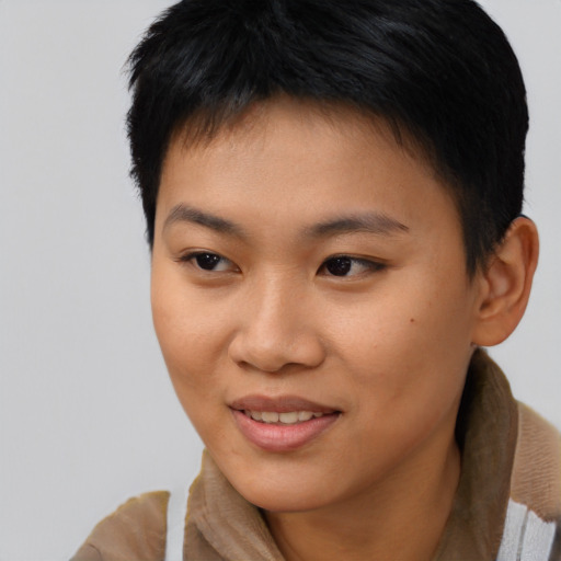 Joyful asian young-adult female with short  brown hair and brown eyes