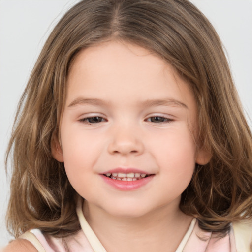 Joyful white child female with medium  brown hair and brown eyes