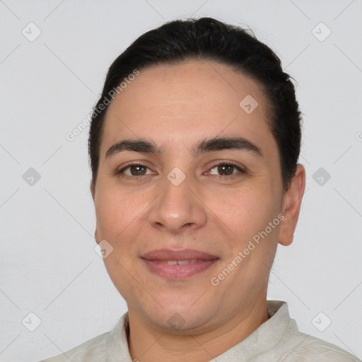 Joyful white young-adult male with short  black hair and brown eyes