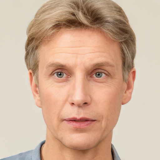 Joyful white adult male with short  brown hair and grey eyes