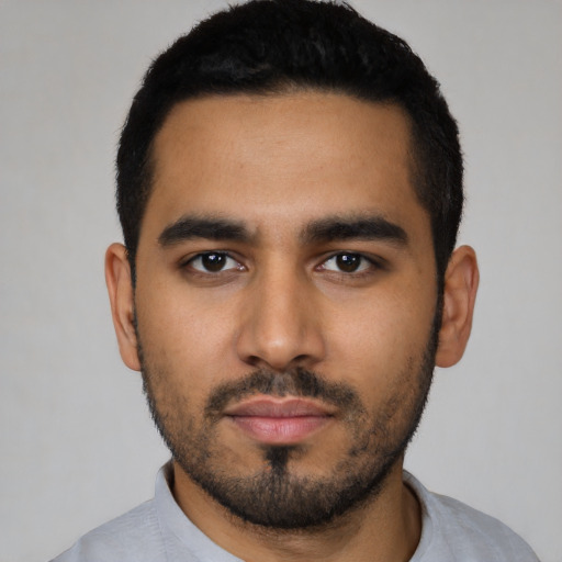 Neutral latino young-adult male with short  black hair and brown eyes