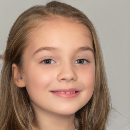 Joyful white child female with long  brown hair and brown eyes