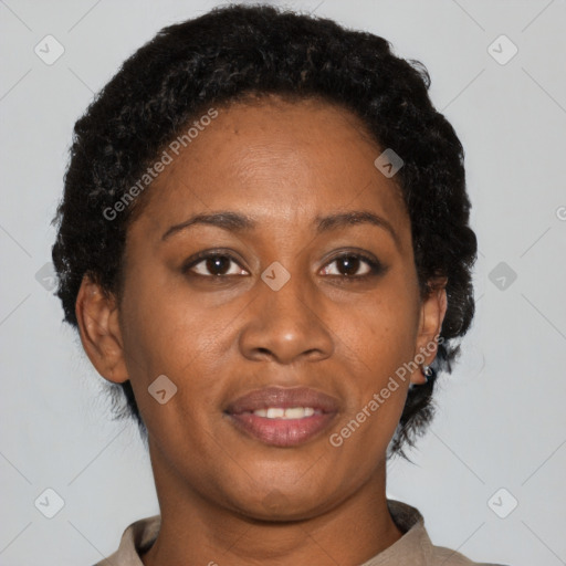 Joyful black adult female with short  brown hair and brown eyes