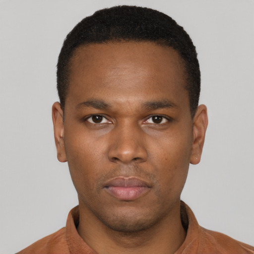Neutral black young-adult male with short  black hair and brown eyes