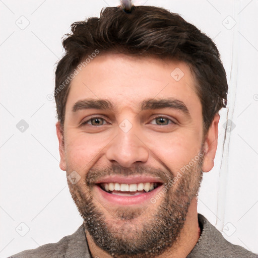 Joyful white young-adult male with short  black hair and brown eyes