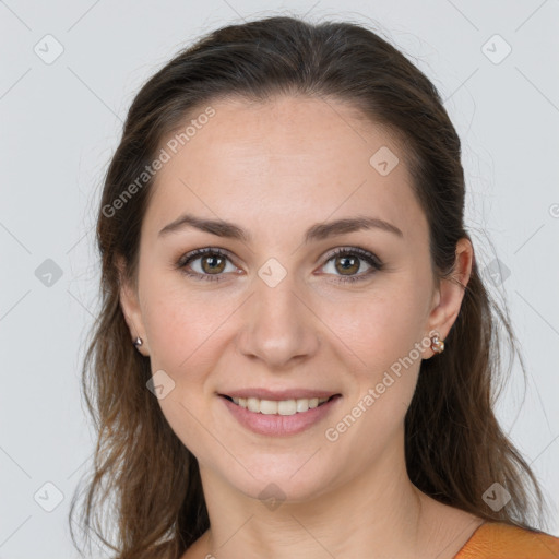 Joyful white young-adult female with long  brown hair and grey eyes