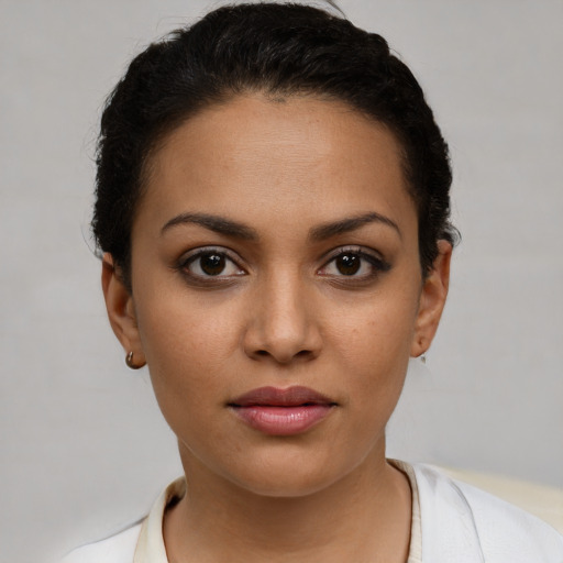 Joyful white young-adult female with short  black hair and brown eyes
