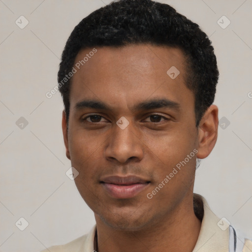 Joyful black young-adult male with short  black hair and brown eyes