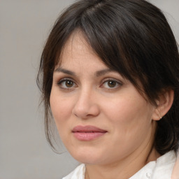 Joyful white adult female with medium  brown hair and brown eyes