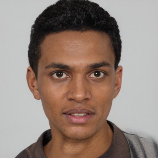 Neutral black young-adult male with short  black hair and brown eyes