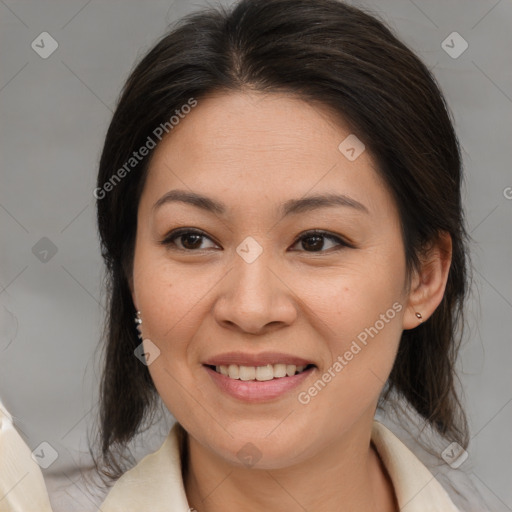 Joyful latino young-adult female with medium  brown hair and brown eyes