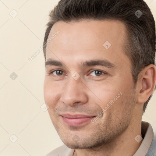 Joyful white young-adult male with short  brown hair and brown eyes