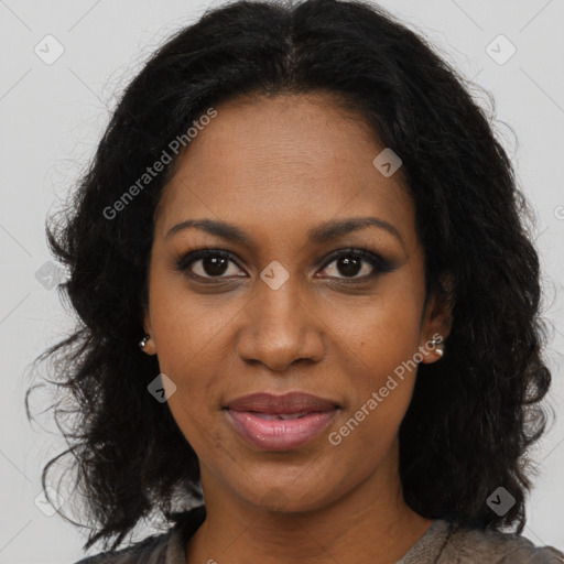 Joyful black young-adult female with long  brown hair and brown eyes