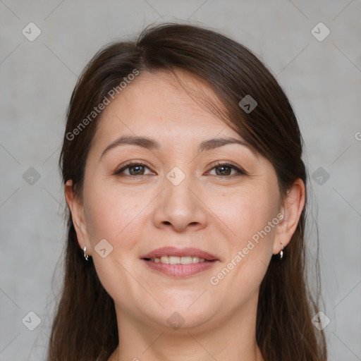 Joyful white adult female with medium  brown hair and brown eyes