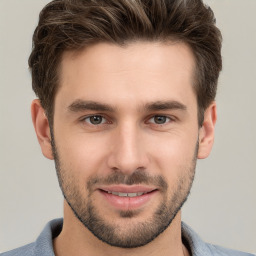 Joyful white young-adult male with short  brown hair and brown eyes