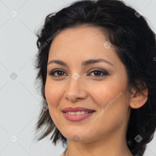 Joyful latino young-adult female with medium  brown hair and brown eyes