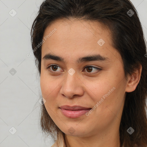 Joyful white young-adult female with medium  brown hair and brown eyes