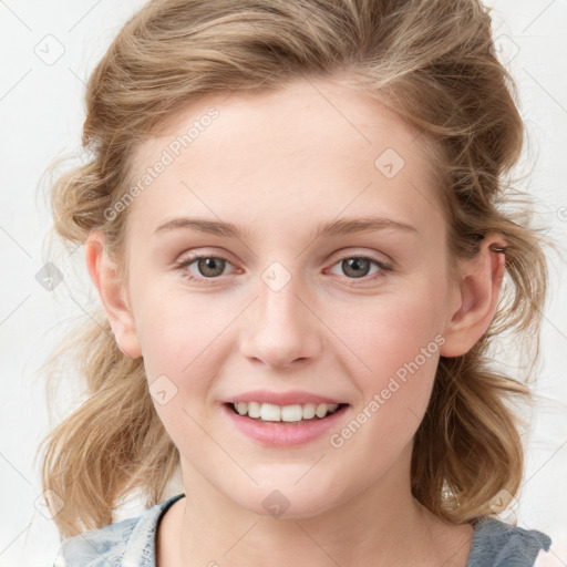 Joyful white child female with medium  brown hair and blue eyes