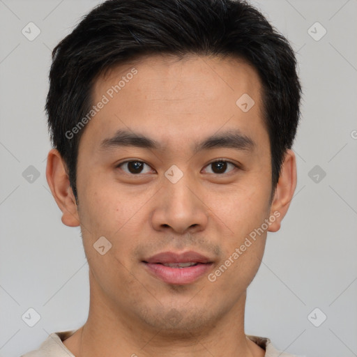 Joyful asian young-adult male with short  brown hair and brown eyes