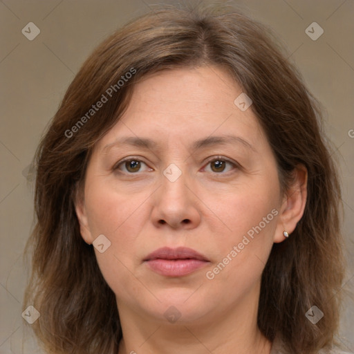 Joyful white adult female with medium  brown hair and brown eyes