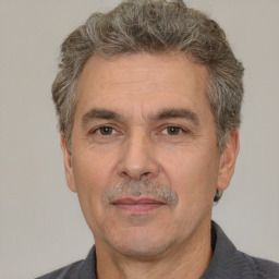 Neutral white adult male with short  gray hair and brown eyes
