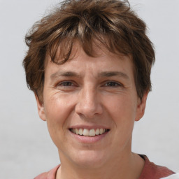 Joyful white adult female with short  brown hair and brown eyes