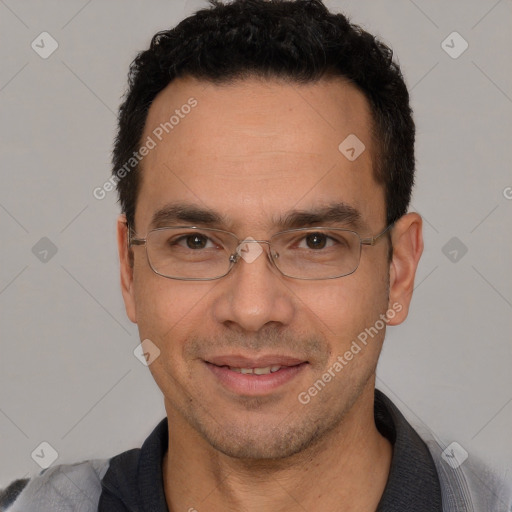 Joyful white adult male with short  black hair and brown eyes